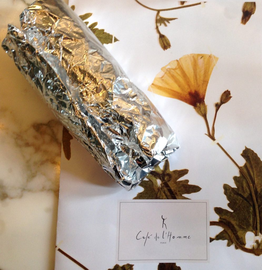 Aluminum foil roll at Café de l'Homme, a doggy bag for restaurant leftovers signifying the approach of different cultures. (Image © Meredith Mullins.)