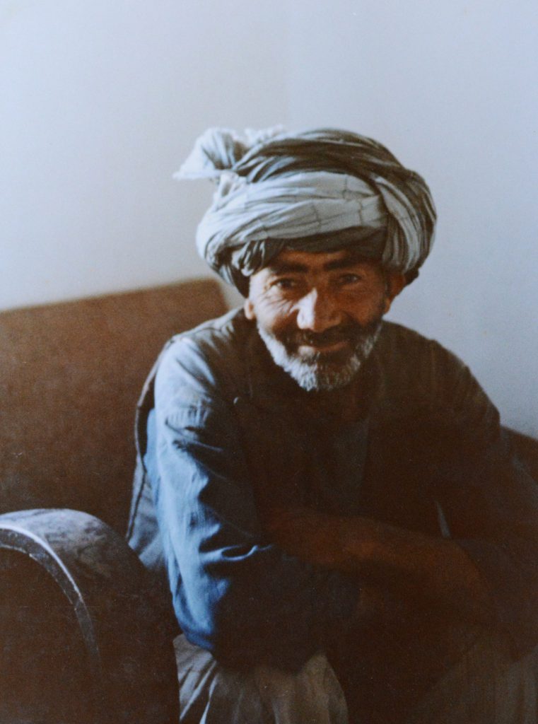 Afghan man, Mustafa, from Tashkurgan, Afghanistan, a character in the travel stories leading to memorable travel adventures. (Image © Meredith Mullins.)