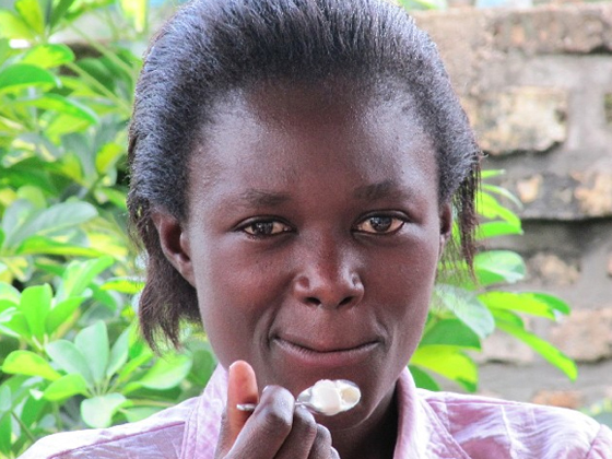 Rwanda girl tastes ice cream, breaking cultural barriers. (Image courtesy of Liro Films.)