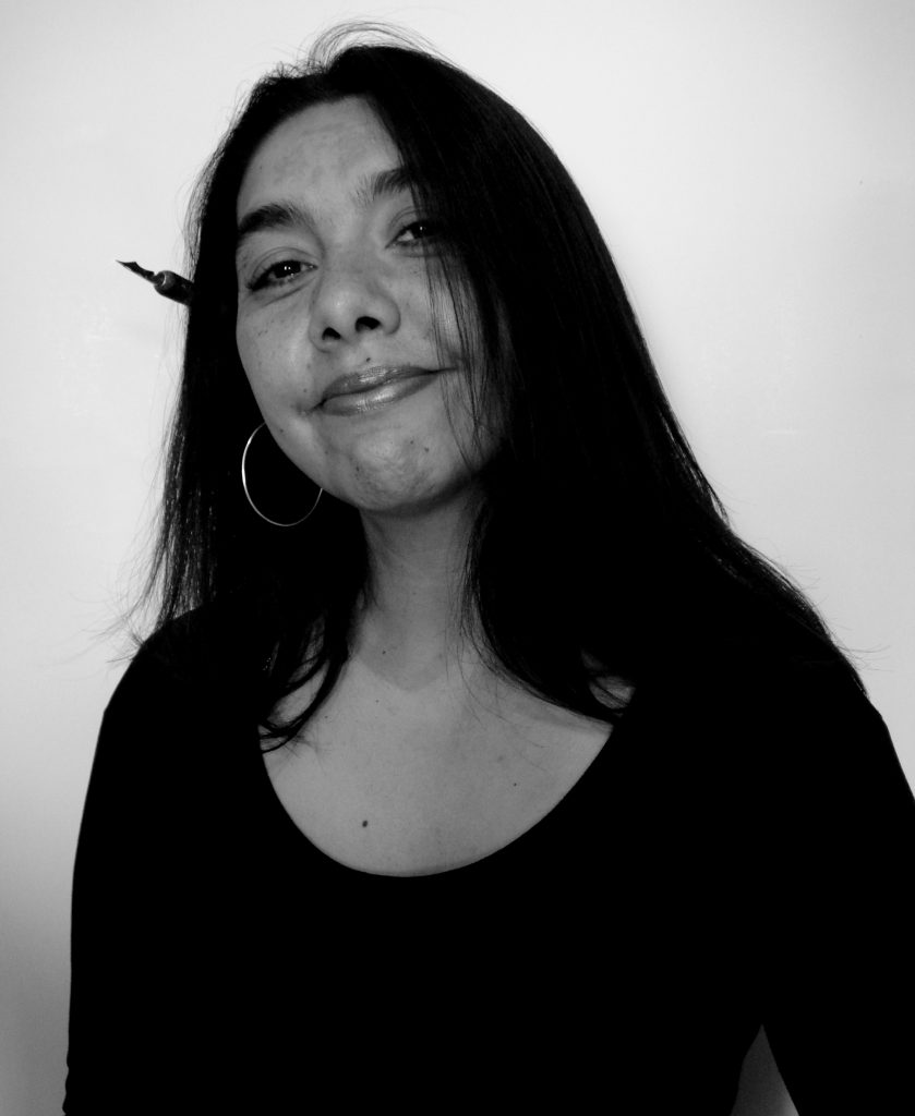Artist Cintia Bolio with a drawing pen behind her ear is a Mexican cartoonist who fights gender stereotypes. (image © Cintia Bolio).