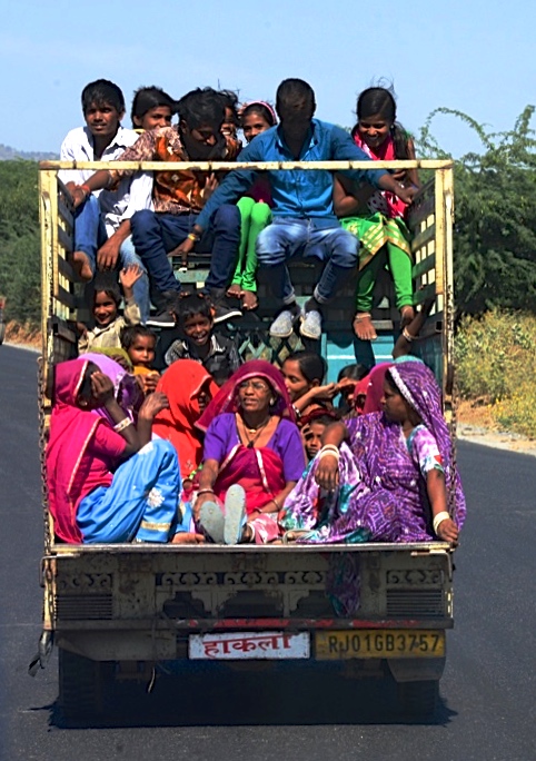 Truck full of travelers to Pushkar in Rajasthan, India, a place for travel adventures. (Image © Meredith Mullins.)