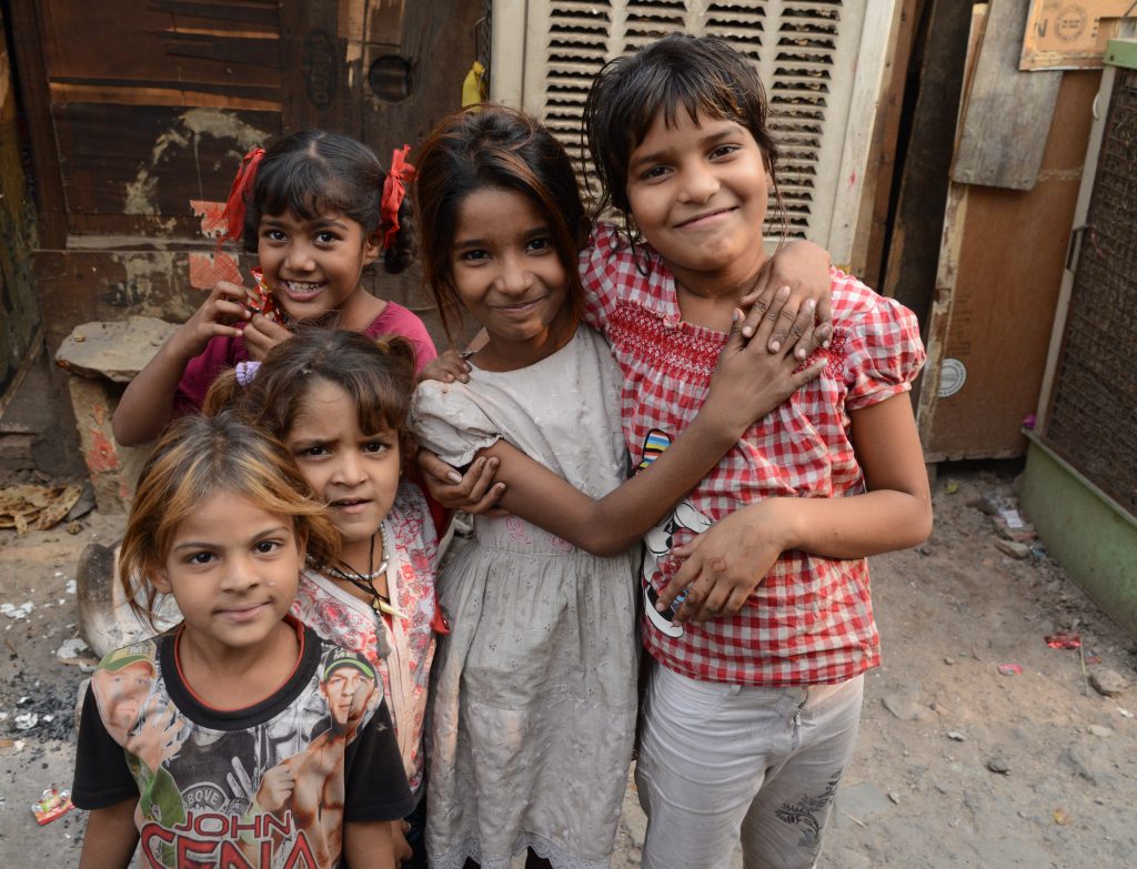 Girls of the Kathputli Colony in Delhi, showing cultural encounters in the slums of India. (Image © Meredith Mullins.)