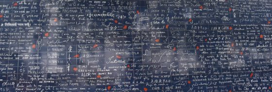 The Paris Wall of Love in Montmartre, showing ways to say I love you in many languages. (Image © Meredith Mullins.)
