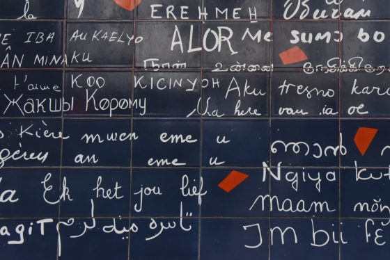 Part of the Paris Wall of Love in Montmartre Paris, showing many ways to say I love you in different languages. (© Meredith Mullins.)