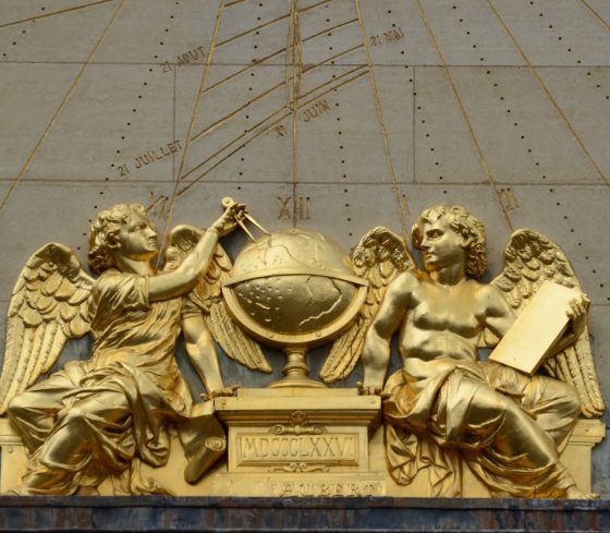 Gold-painted angels at the Sorbonne sundial, angels of Paris that serve a cultural symbols. (Image © Rosemary Flannery.)