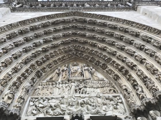 A portal of the cathedral of Notre-Dame, showing angels of Paris that serve as cultural symbols. (Image © Meredith Mullins.)