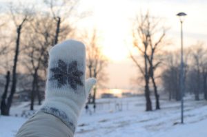 A waving hand on a winter day shows that saying hello is universal across cultures. (Image © Banepx/iStock)