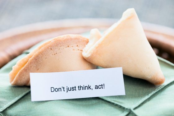 Fortune cookies with proverbs and sayings like "Don't just think, act." (Image © Nicolesy/iStock.)