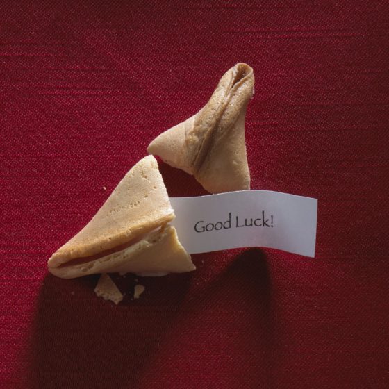 Cracked fortune cookie with a message "Good luck" from all the proverbs and sayings in fortune cookies. (Image © Brand X Pictures/Stockbyte.)