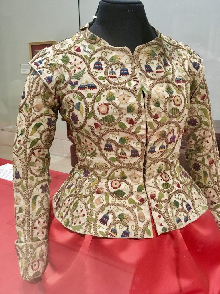A 17th century noblewoman's waistcoat at a textile exhibition in Glasgow, Scotland threads the needle between clothing idioms' wordplay and their source. (Image @ Joyce McGreevy)