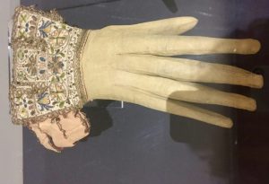 A 17th century glove from Glasgow's Burrell Collection inspires off-the-cuff wordplay and other clothing idioms. (Image © Joyce McGreevy)