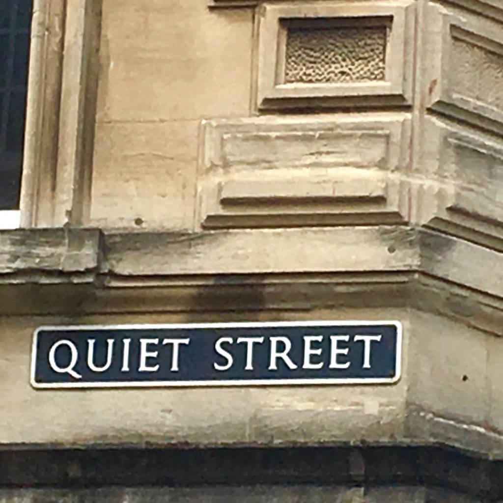 A street sign in Bath, England shows why walking is a great way of seeing the world close up. (Image @ Joyce McGreevy)