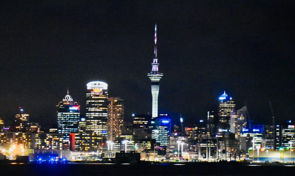 A night skyline of Auckland, New Zealand inspires an author to consider the true nature of time travel adventures. (Image © Joyce McGreevy)