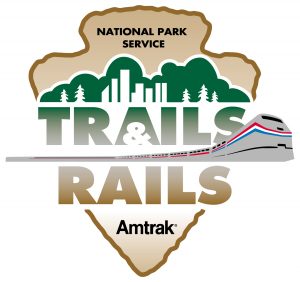 The logo for Trails & Rails, a partnership of Amtrak and the National Park Service, inspires travelers throughout the U.S. with aha moments. (image by NPS/Amtrak)