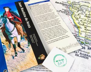 A National Park Service booklet, map, and passport stamp are souvenirs of aha moments during a Trails & Rails talk on the Coast Starlight. (Image © Joyce McGreevy)