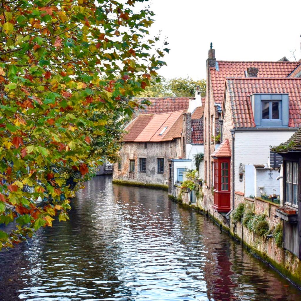 A colorful canal view in Bruges inspires a traveler in Belgium. (Image © Joyce McGreevy)