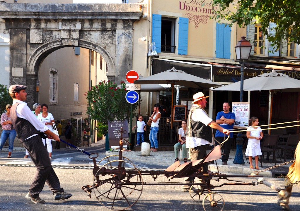 Farmers and equipment in parade celebrating French cultural heritage and traditions