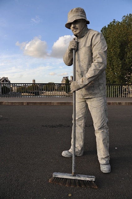 Paris mime sweeping street, causing the writer to see things differently