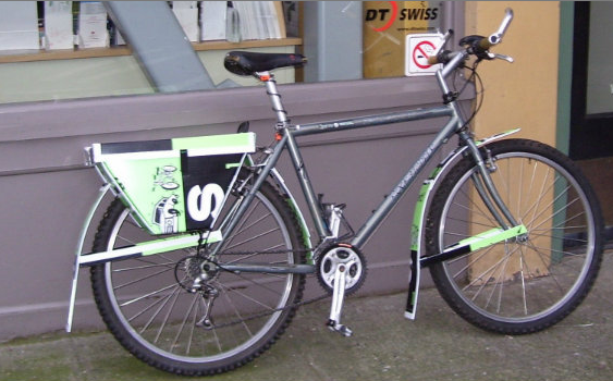 campaign sign showing a clever use as bicycle parts