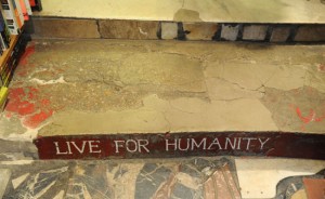 Creative inspiration from Shakespeare and Company steps saying Live for Humanity