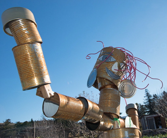 An art project scarecrow in an organic school garden inspires life lessons for students