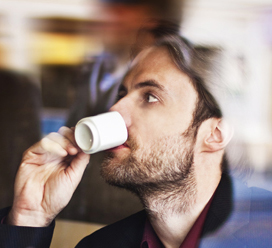 man drinking european coffee after receiving a random act of kindness of a caffe sospeso