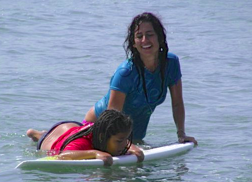 Girl achieving success through surfing with The Wahine Project