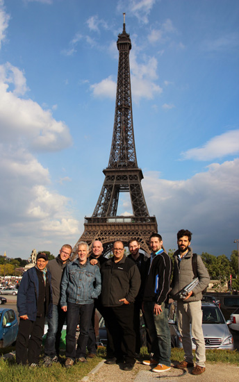 The Tower Music Team in front of the Eiffel Tower, artistic expression from teamwork.