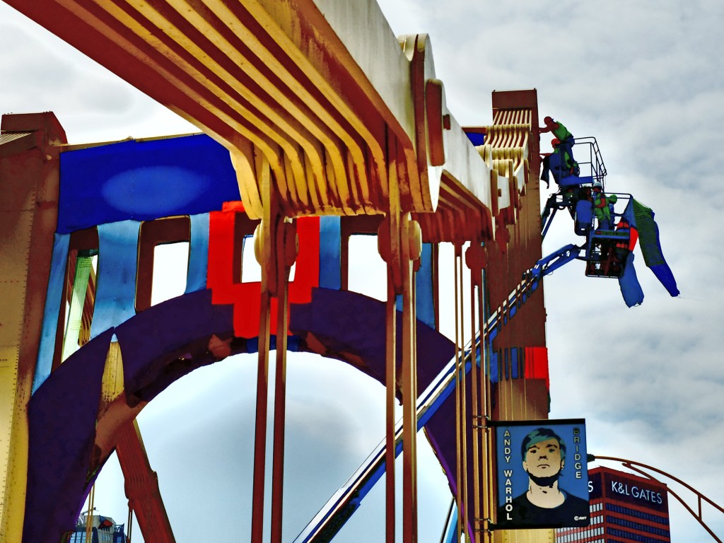 Installing knit panels as part of a yarn bombing public art project on Pittsburg's Andy Warhol Bridge. Image © Knit the Bridge