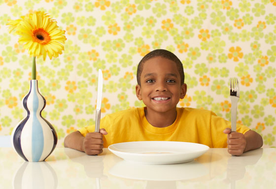 Lefty at the dinner table, illustrating overcoming obstacles and Left-Handers' Day