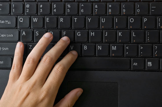 left hand on keyboard, illustrating overcoming obstacles and Left-Handers' Day