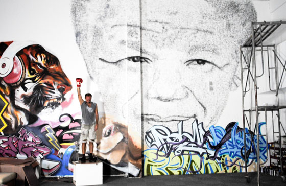 Street portrait of Nelson Mandela, created with Chinese seals and illustrating the art of going across cultures