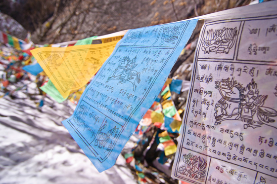 Closeup of Tibetan prayer flags, a cultural tradition for sending blessings of good fortune