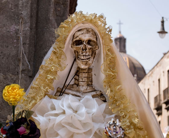 Headressed skeleton in Day of the Dead parade, one of the Halloween traditions and cultural traditions from Mexico (Photo © iStock)