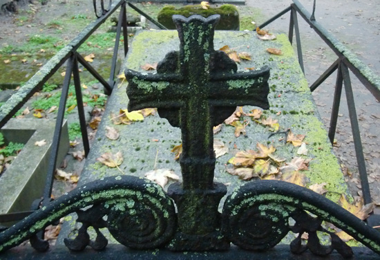 cross on a tombstone, one of the Halloween traditions and cultural traditions in France (Photo © Meredith Mullins)