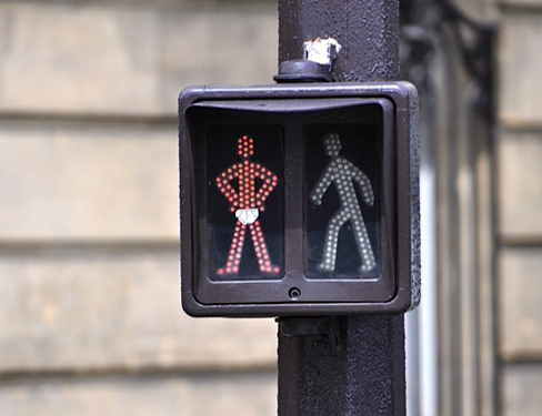 Stop and go sign at crosswalk, artistic expression by a street artist (Image © Sherry Long)