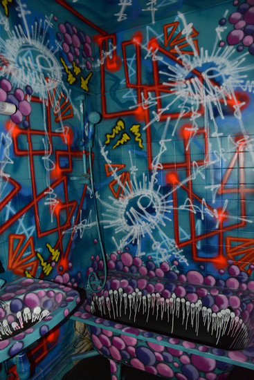 Painted bathroom, artistic expression of street art at the Tour 13 (Photo © Meredith Mullins)