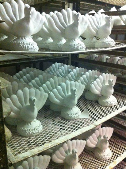 Shelves of white plaster Menurkeys, crossing cultures with Thanksgiving and Hanukkah
