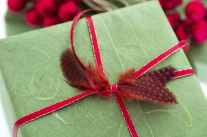 Present tied up with feathers in the bow, showing a Chinese tradition in which a feather symbolizes gift-giving with great sincerity and respect. Image © Studio-Annika / iStock