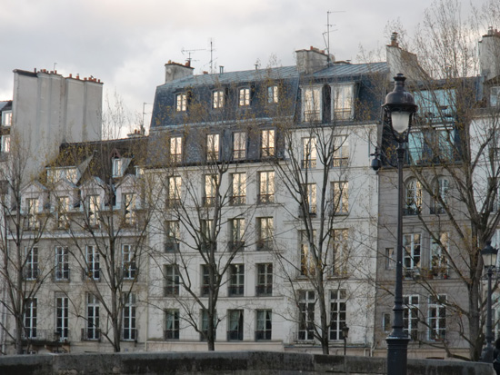 Sunset reflections in windows, showing life lessons and memorable moments from Paris in the 2013 year in review (Photo © Meredith Mullins)