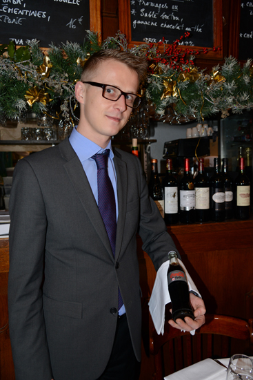 Waiter with coke, showing life lessons and memorable moments in Paris from the 2013 year in review (Photo © Meredith Mullins)