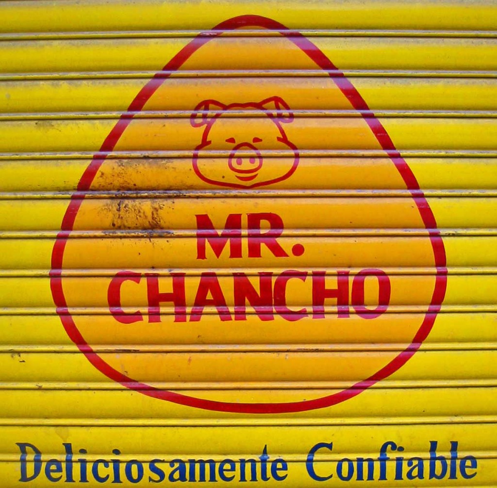 Bilingual sign in Ecuador, part of a language learning experience that caused a shift in life goals. (Image © Bruce Goldstone)