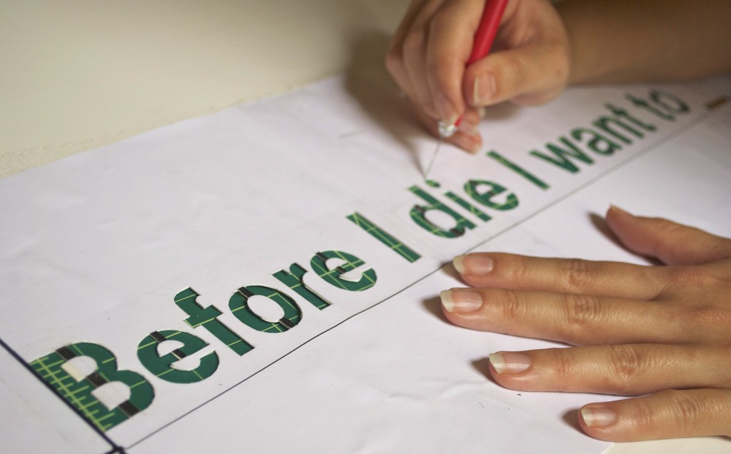Stencil for the "Before I die" statement being created by Candy Chang. Image © Kristina Kassem.
