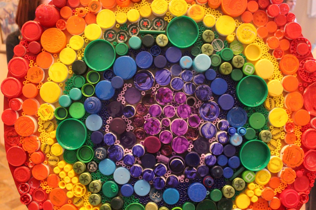 The rainbow dot, made from smaller, colorful dots of found plastic for Peter Reynolds' International Dot Day. (Image © Janine Boylan)