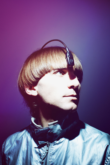 Neil Harbisson, a human cyborg, wearing a head device which expands his senses for creative expression (Photo © Dan Wilton/Red Bulletin)