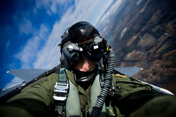 A fighter pilot snaps a selfie, showing his creative expression for a visual diary of his adventures. (Image © Stocktrek Images)