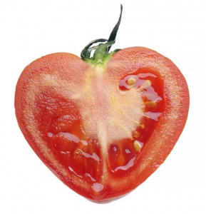 Heart-shaped tomato, illustrating a love quote for Valentine's Day. (Image © pryzmat / iStock)