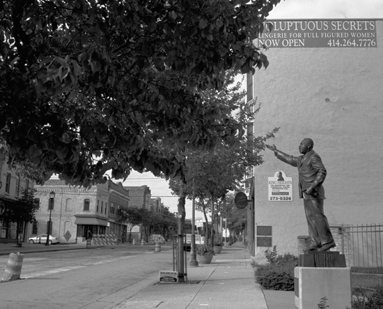 Street in Milwaukee, WI with at statue of Martin Luther King, Jr., artistic expression by Susan Berger on a photographic journey to capture images of America  (© Susan Berger)