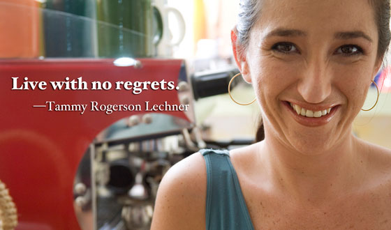 Woman sitting happily in a cafe illustrates this good advice to live life well: Live with no regrets.