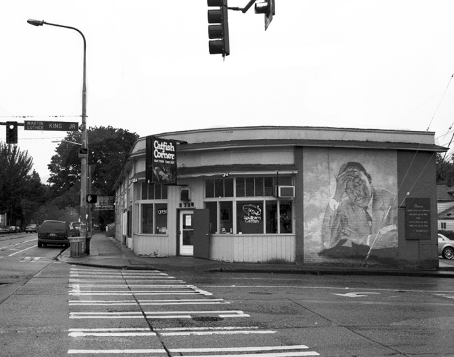 Storefront with drawing of Martin Luther King, Jr. in Seattle, Washington, artistic expression by Susan Berger on a photographic journey to capture images of America (© Susan Berger)